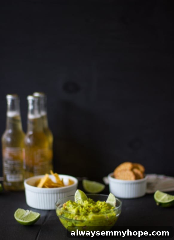 Breakfast Tacos with Fresh Avocado Pico 2 A bowl of spicy guacamole with chips in ramekins.