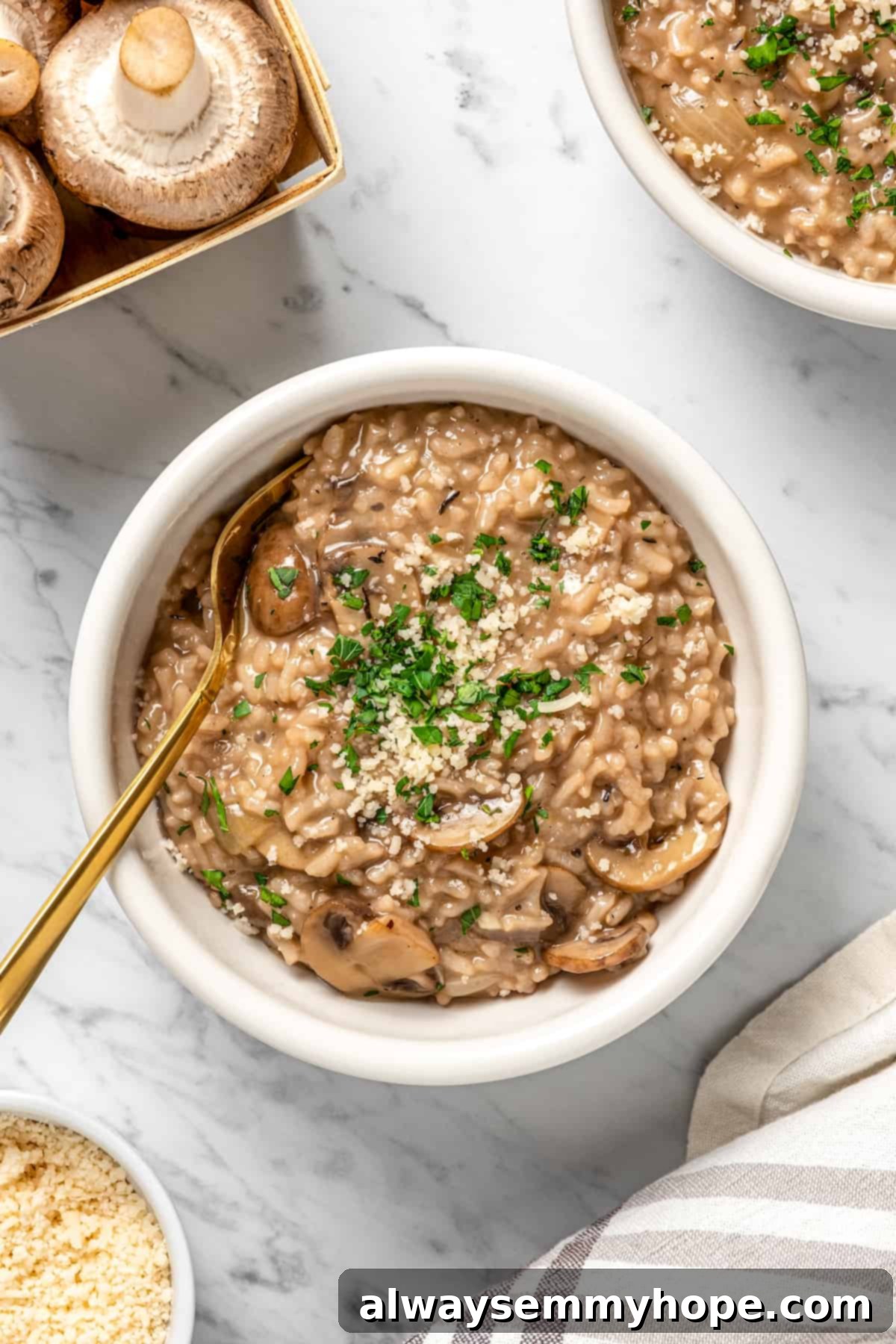 Overhead view of a perfectly plated bowl of vegan Instant Pot risotto, garnished with fresh herbs and a gold spoon, ready to be enjoyed