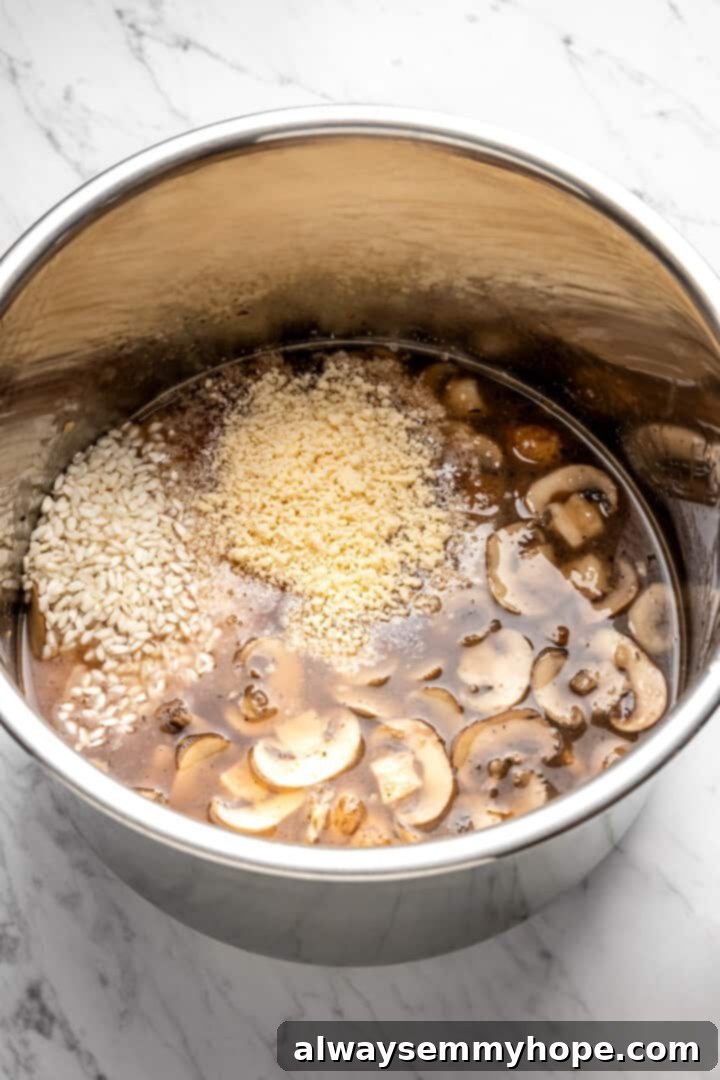 Overhead view of all the vegan risotto ingredients, including arborio rice, mushrooms, and liquids, combined in the Instant Pot insert, ready for pressure cooking