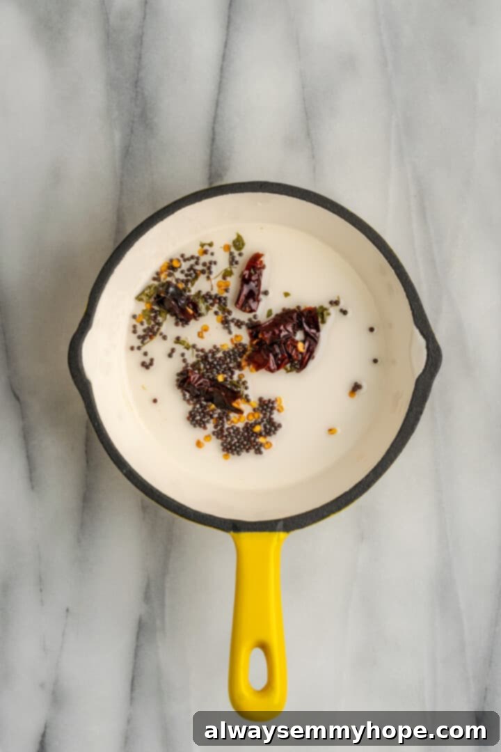 This vegan sambar is just like the sambar at your favourite Indian restaurant! Here's how to make this hearty lentil and veggie stew at home. Spices for tempering sambar in small saucepan