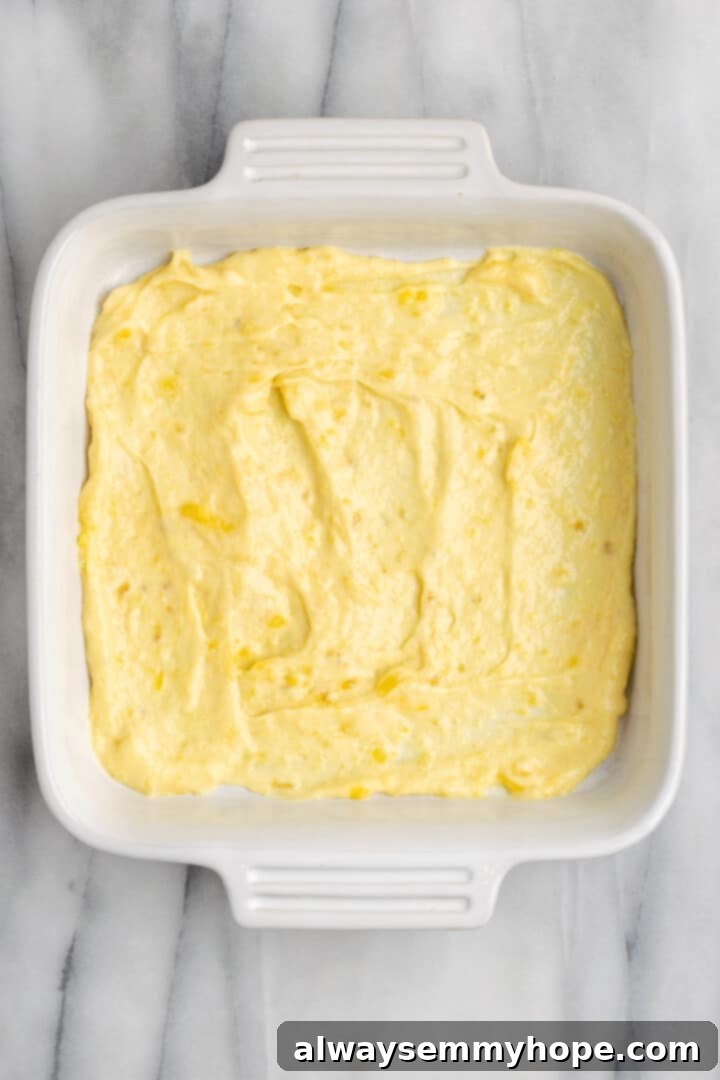 First layer of vegan banana pudding spread in a baking dish