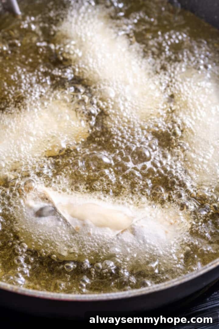 Egg rolls frying in oil