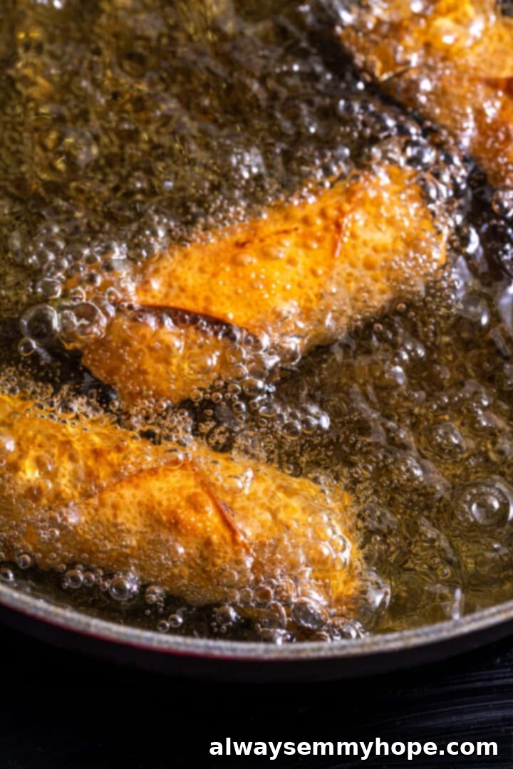 Egg rolls frying in oil