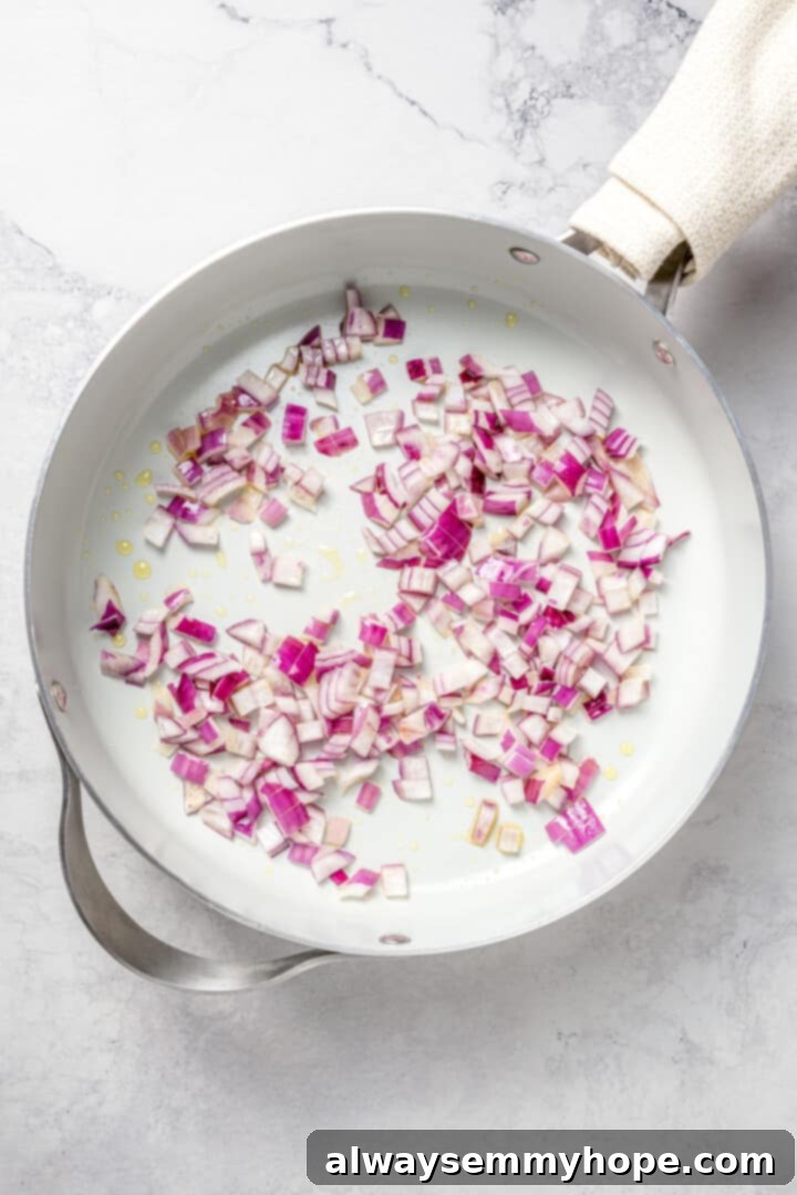 Overhead view of red onions in skillet