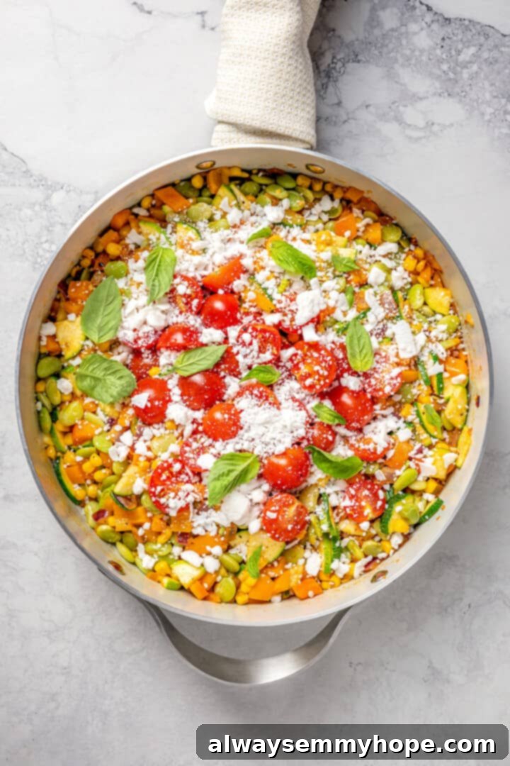 Overhead view of vegan corn succotash in skillet