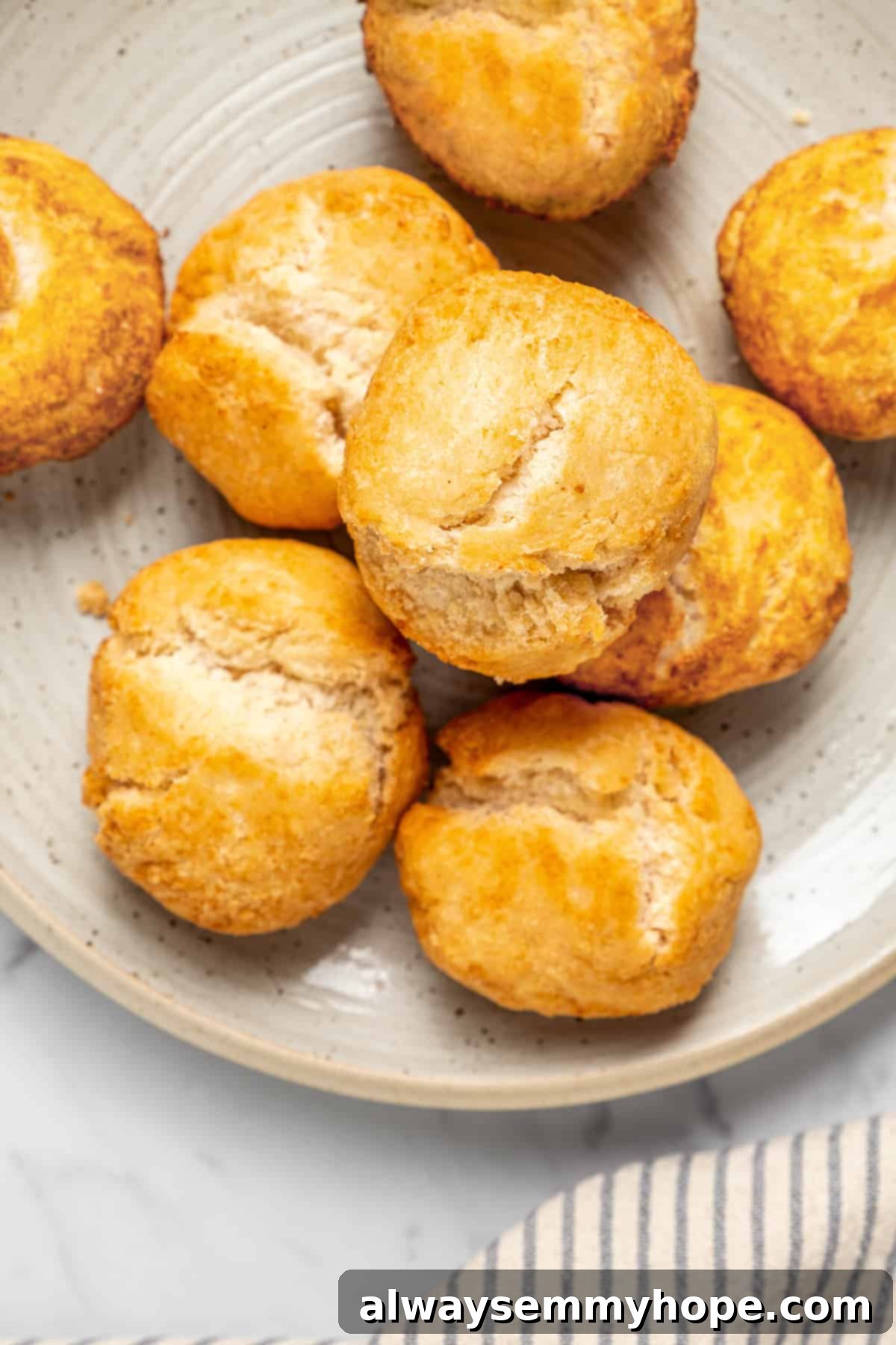 Overhead view of Jamaican fried dumplings stacked on plate