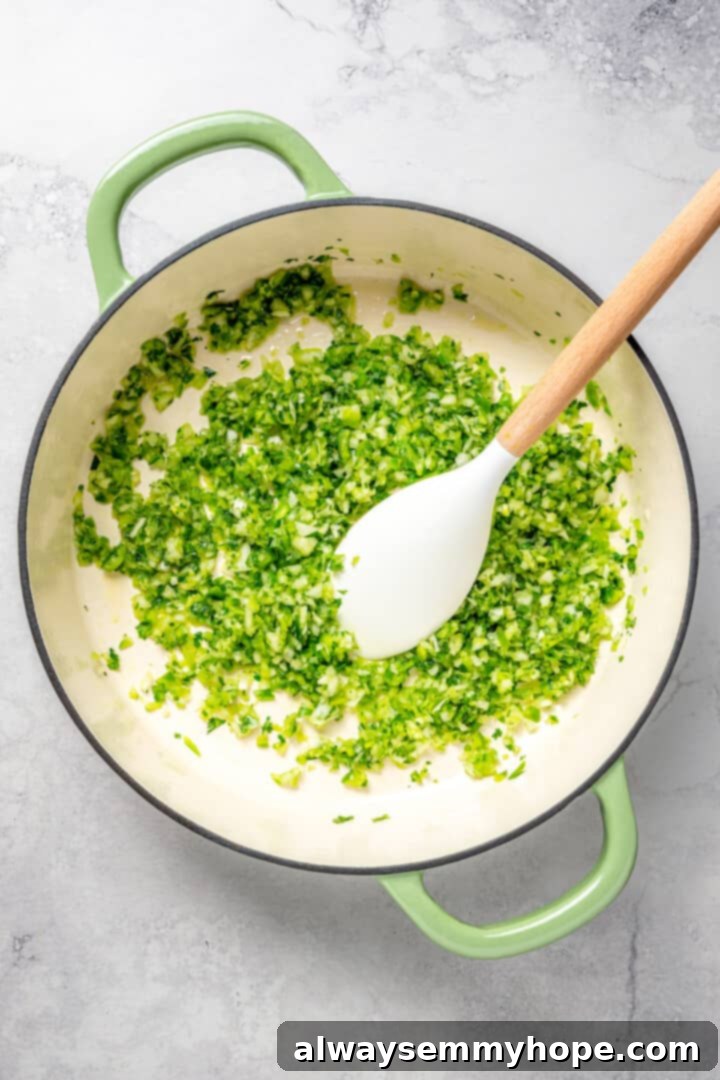 Overhead view of the vibrant sofrito cooking and simmering in a Dutch oven, releasing its aromatic flavors.