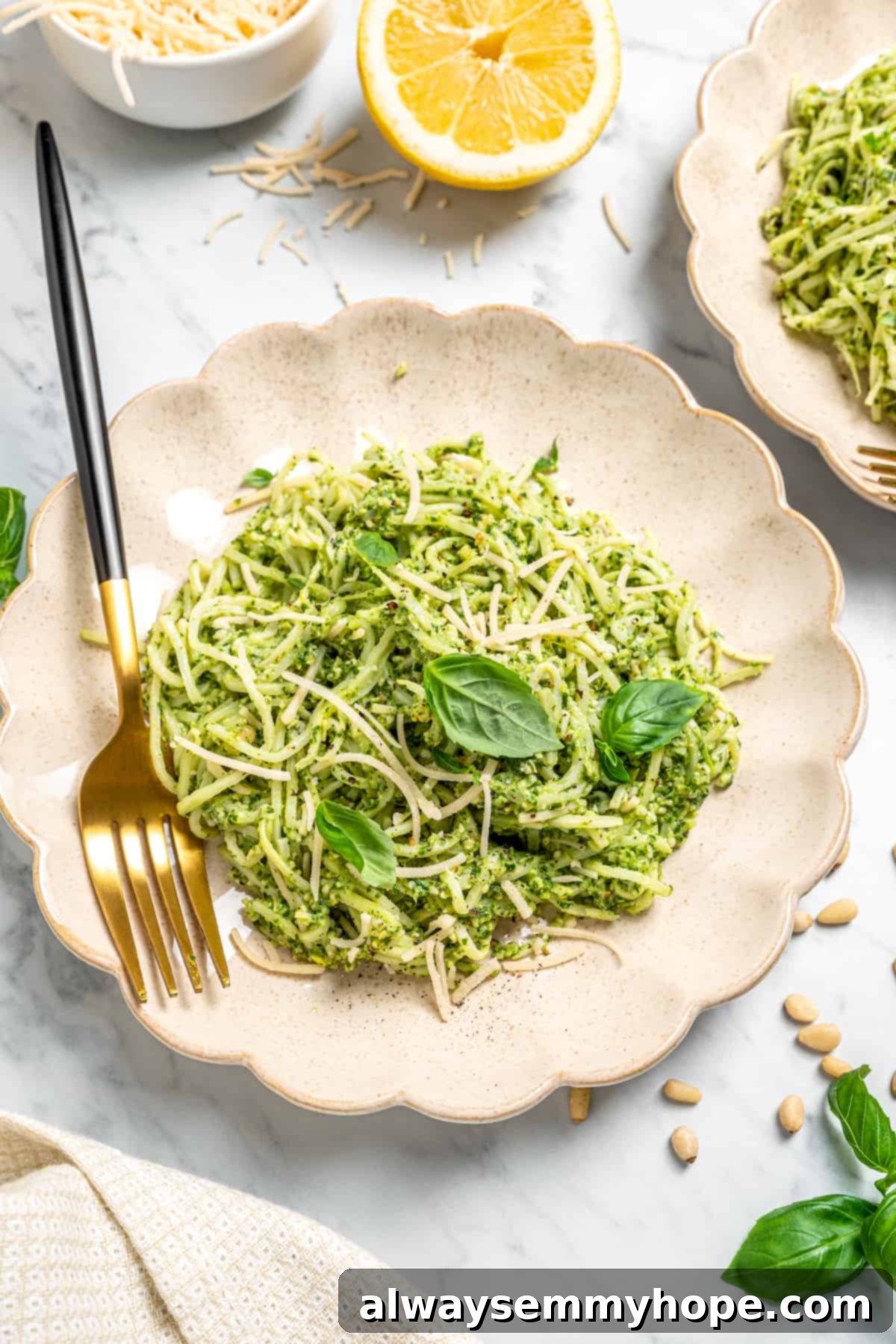 Overhead view of hearts of palm pasta on plate with gold fork
