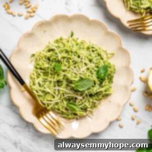 Overhead view of hearts of palm pasta on two plates with gold forks