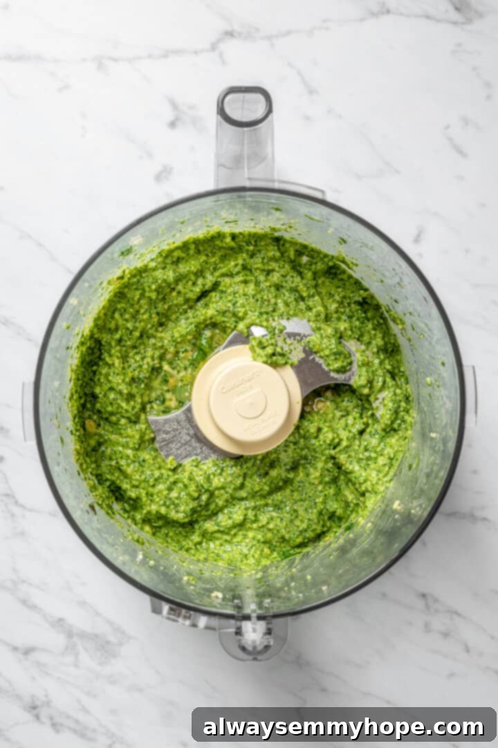 Overhead view of pesto in food processor