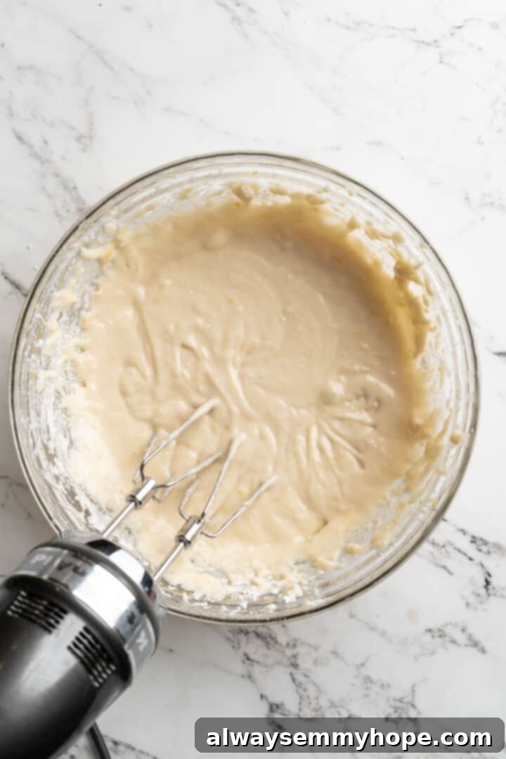 Overhead view of the quick bread batter in a bowl after dry ingredients have been mixed in.