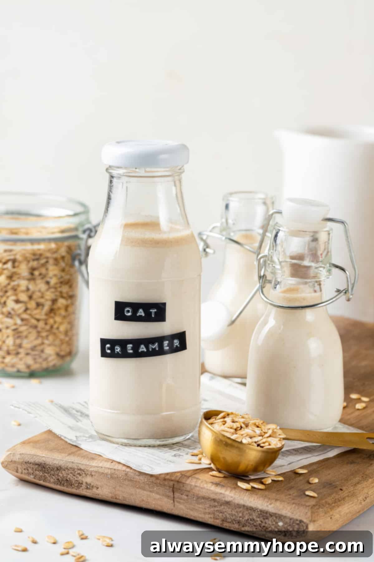 Three glass bottles of homemade oat milk coffee creamer, promising a rich, creamy addition to your coffee.