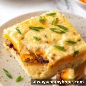 Homestyle Biscuits and Gravy Bake 2 Piece of biscuits and gravy casserole on plate with fork