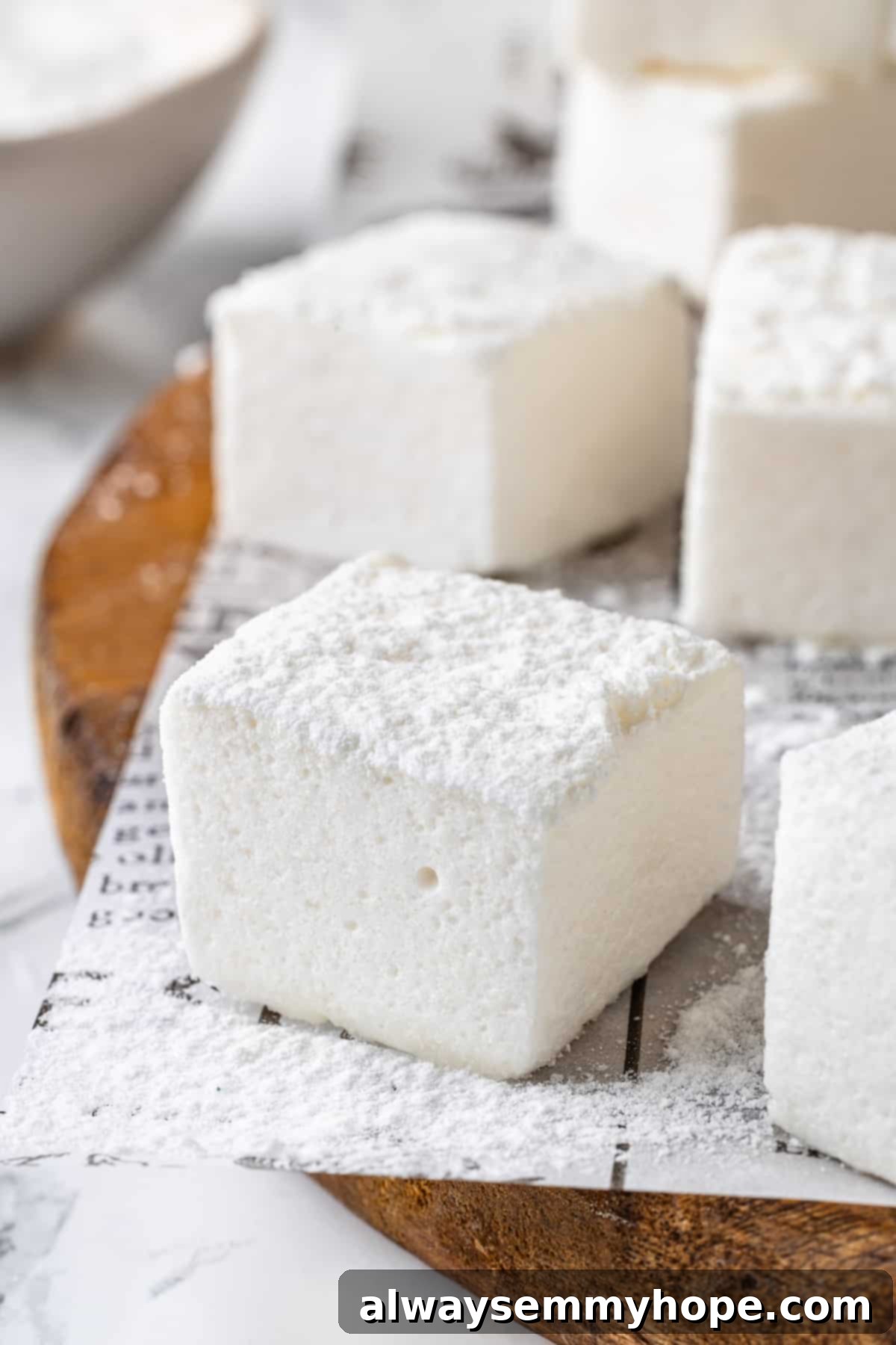 Closeup of vegan marshmallows dusted with powdered sugar and cornstarch