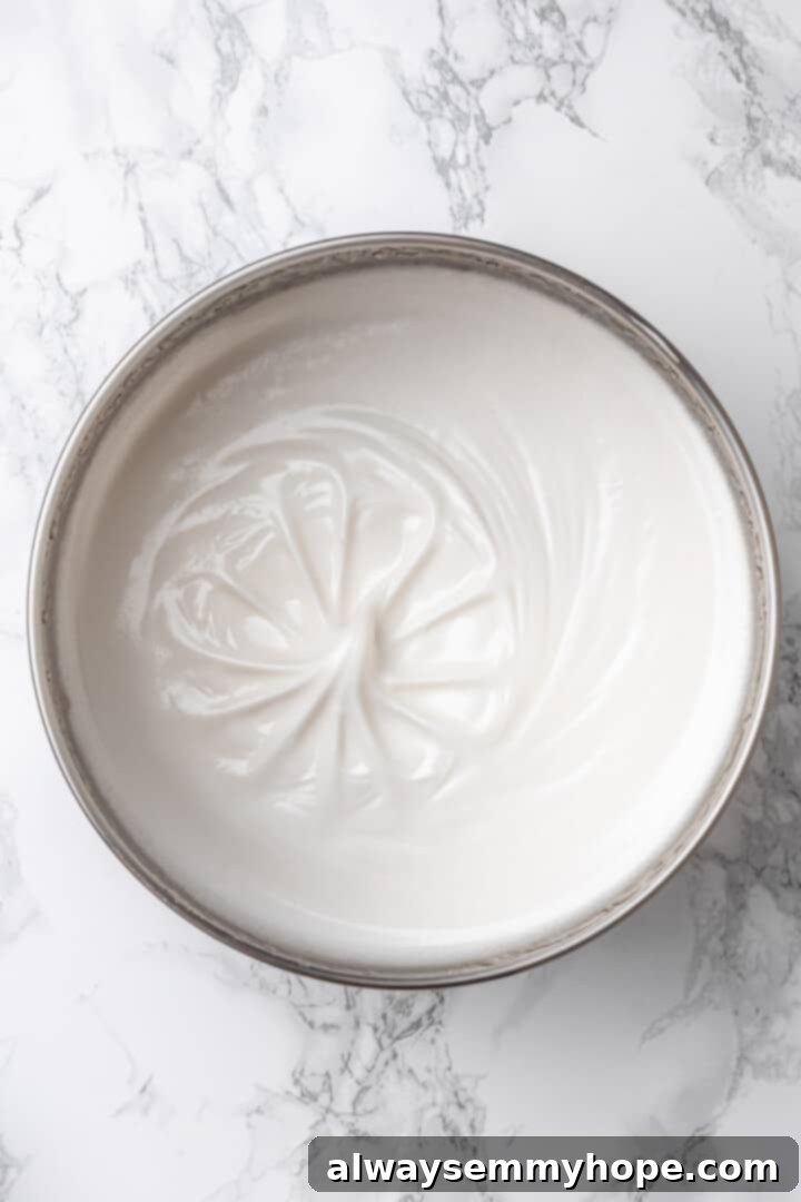 Overhead view of vegan marshmallow mixture in bowl