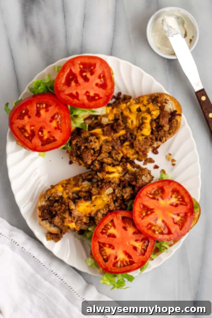 The chopped cheese sandwich is a NYC classic—and now you can make your own vegan version at home! You'll love this easy, delicious recipe. Assembling two Vegan Chopped Cheese sandwiches with fresh toppings