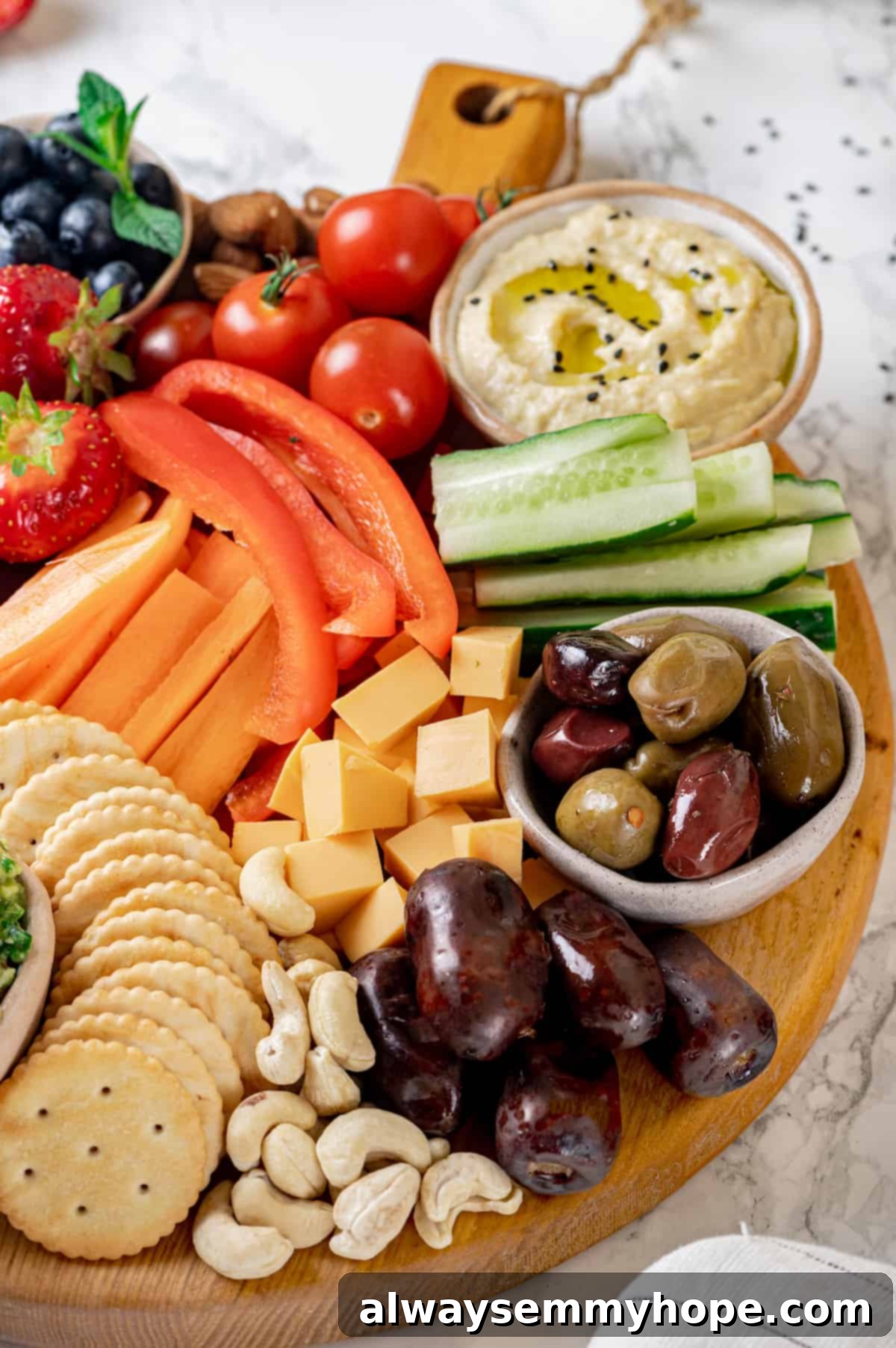 Close-up of a diverse Vegan charcuterie board, showcasing plant-based cheese, juicy olives, crunchy nuts, a variety of fresh fruits, creamy hummus, and crisp vegetables.