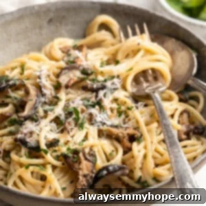 Miso butter pasta in bowl with fork and spoon