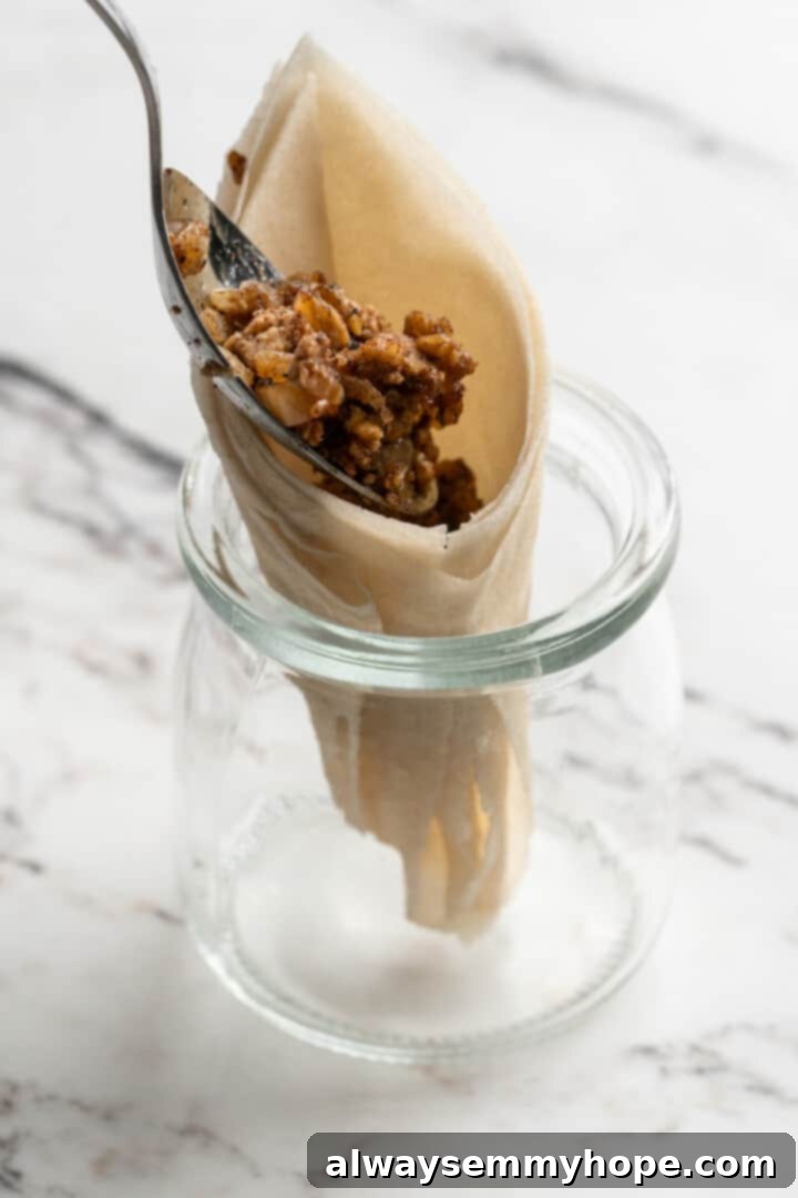 Spooning tofu filling into egg roll wrapper for sambusas