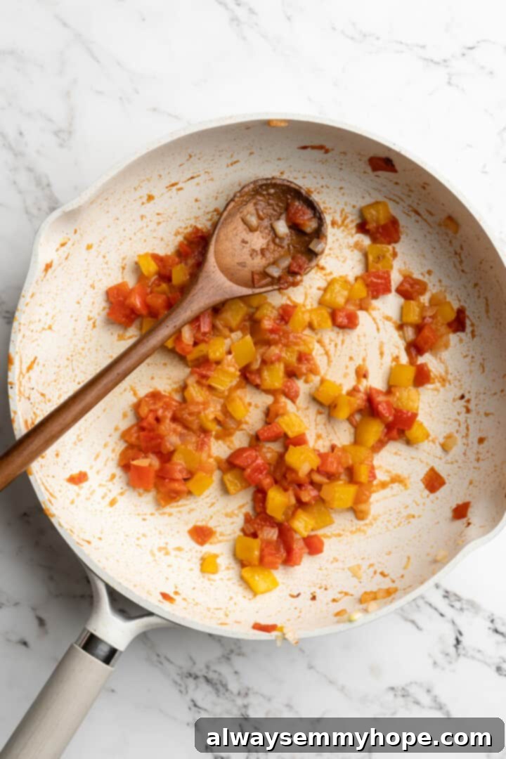 Overhead view of cooked vegetables in skillet