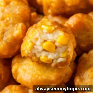 Pile of corn nuggets, with one bitten to show corn kernels inside