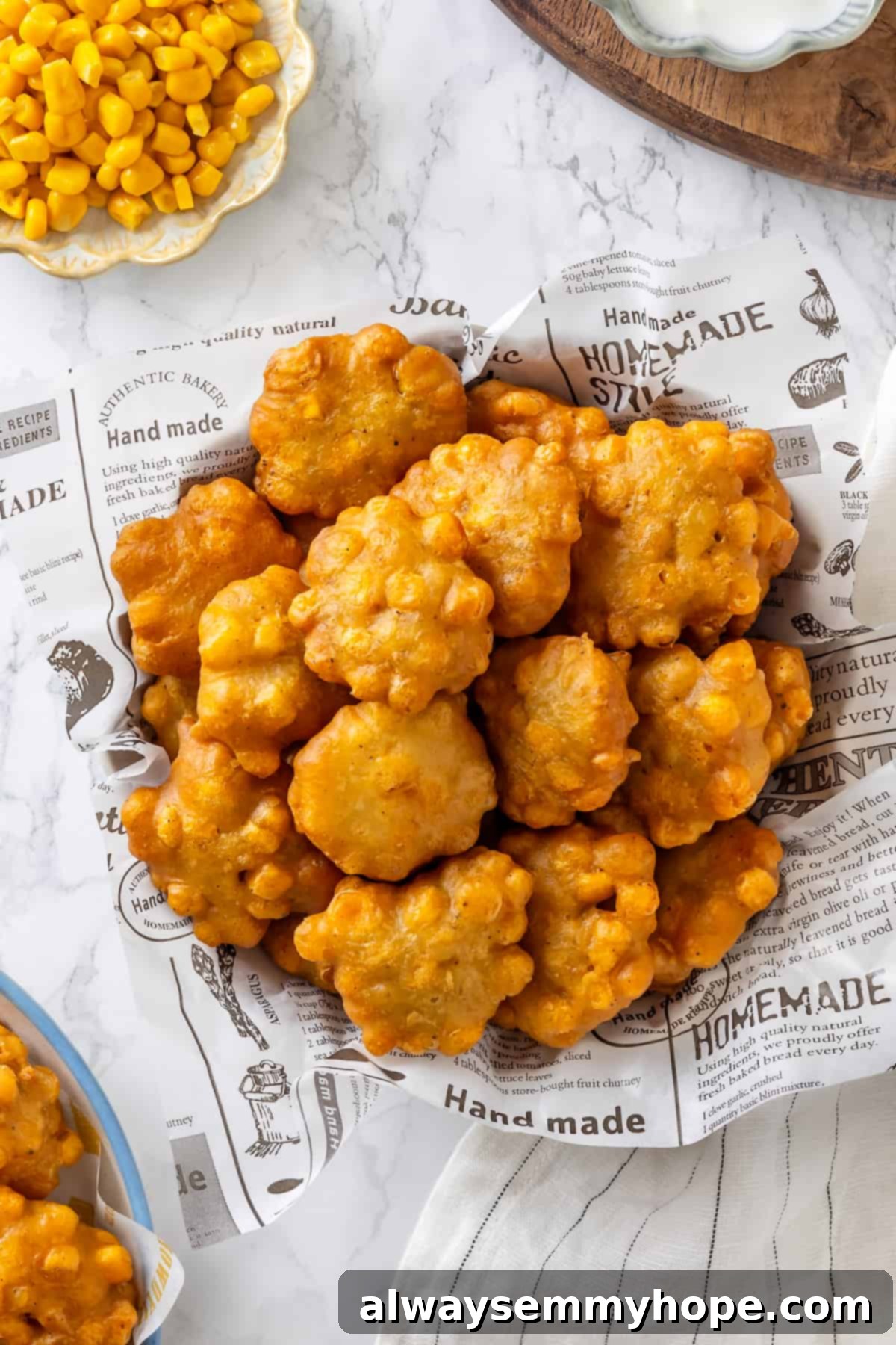 Overhead view of crispy fried corn nuggets in basket