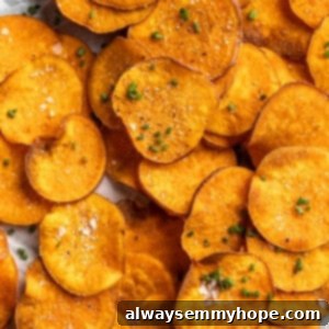 Golden Sweet Potato Crisps 2 Pile of crispy homemade sweet potato chips with sea salt