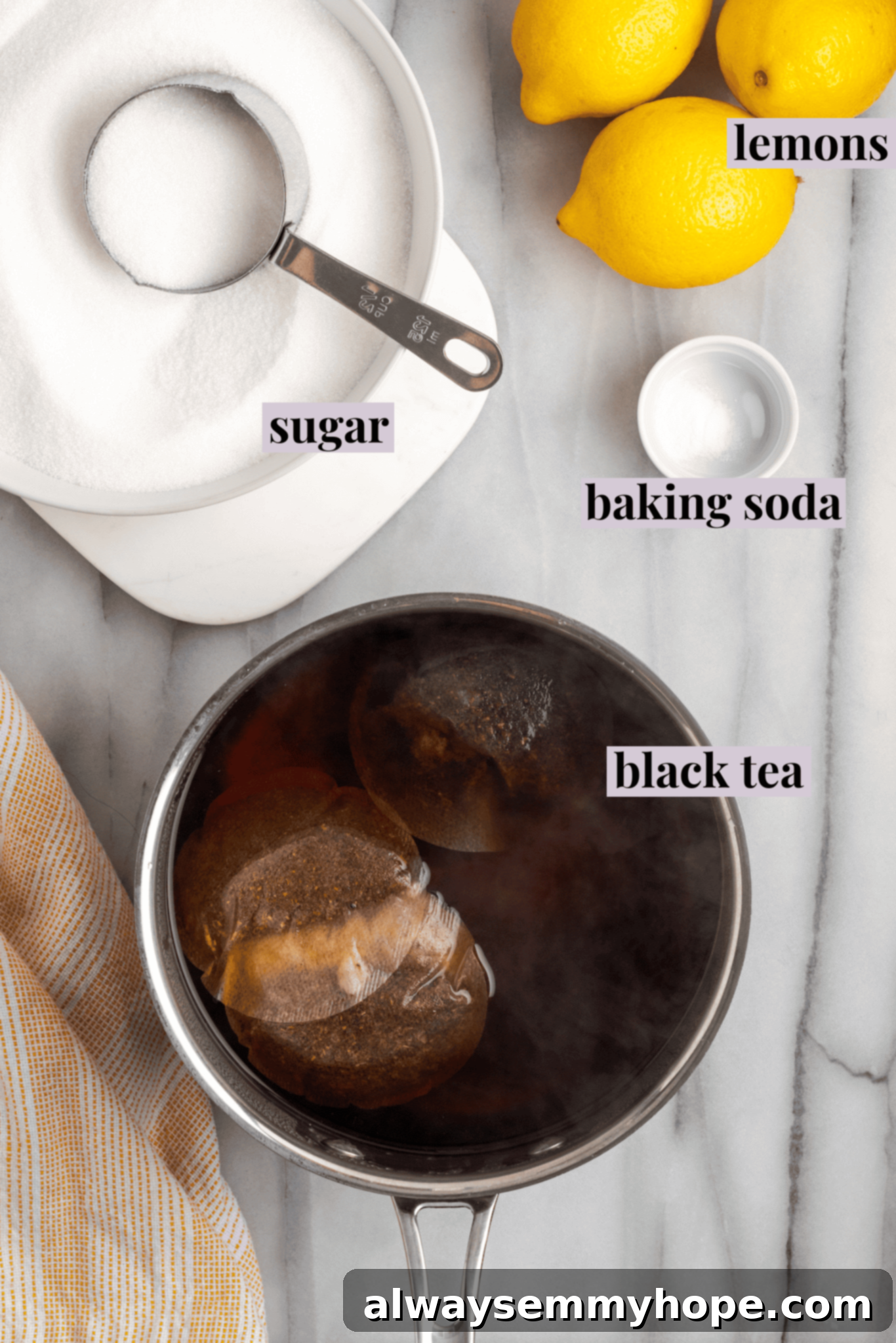 Overhead view of essential ingredients for Southern sweet tea: black tea bags, sugar, and a small container of baking soda, neatly arranged.