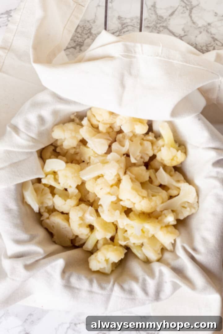 Overhead view of steamed cauliflower in towel