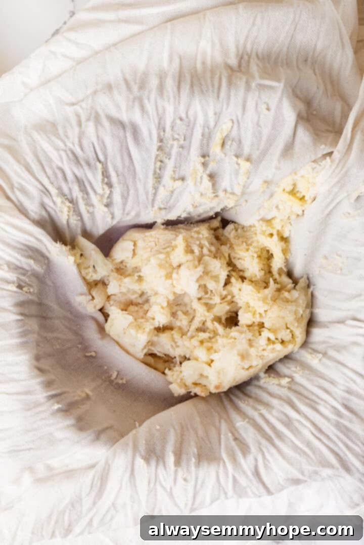 Overhead view of cauliflower wrapped in towel