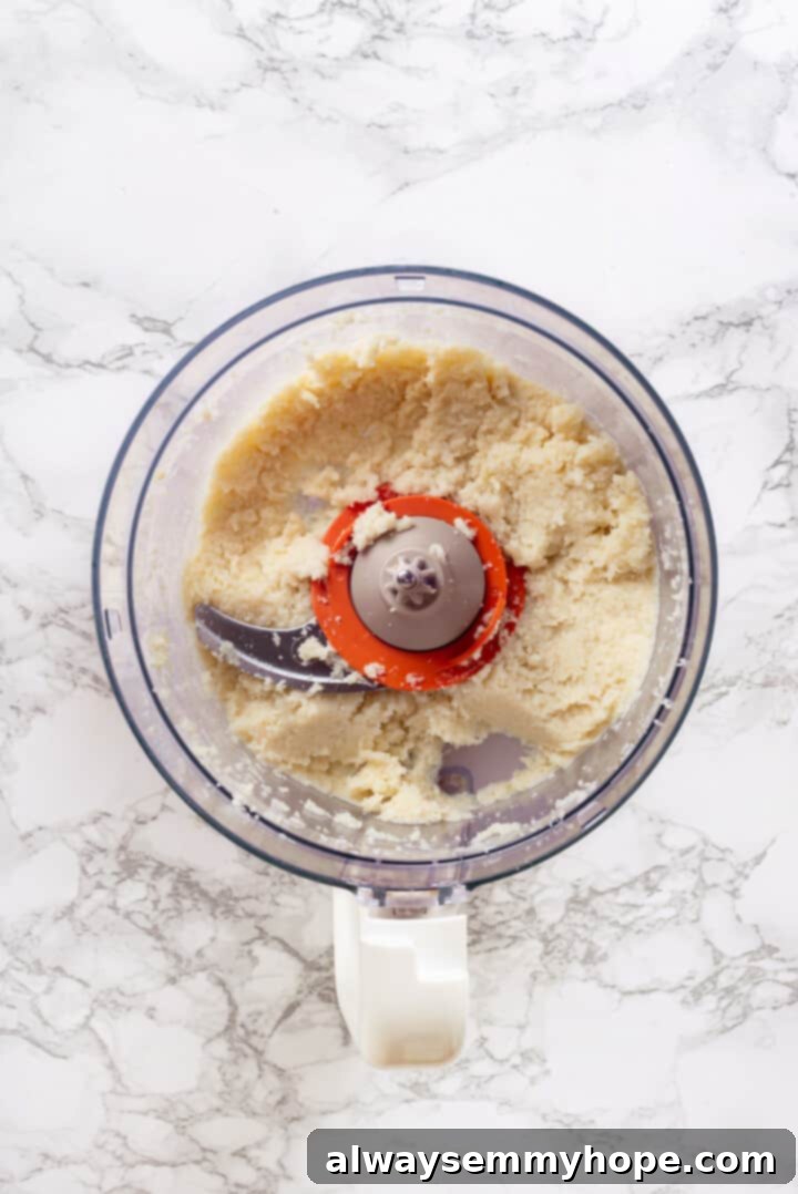 Overhead view of pureed cauliflower in food processor