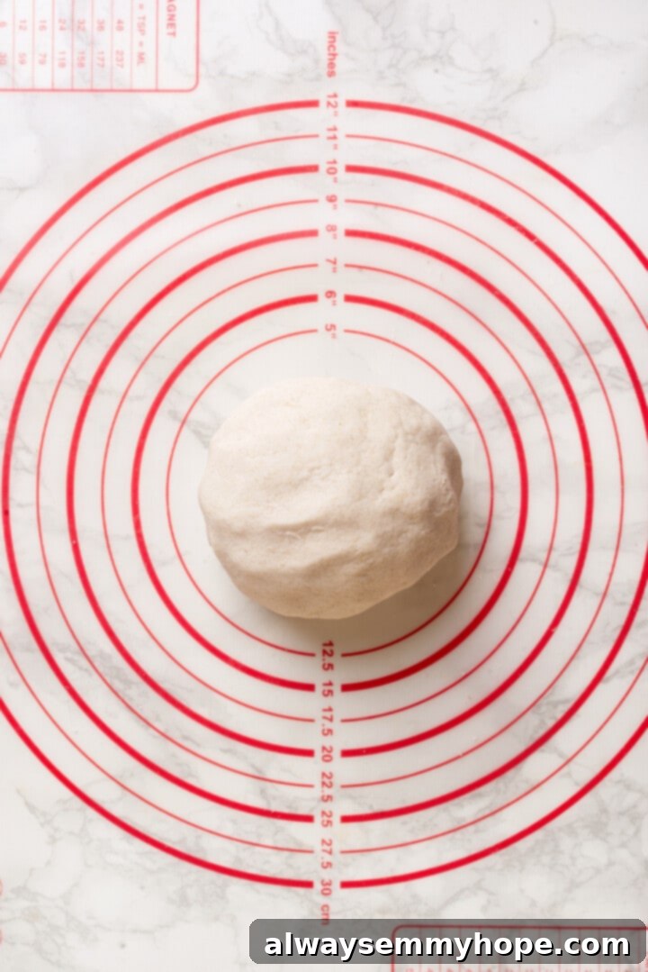 Overhead view of gnocchi dough on baking mat