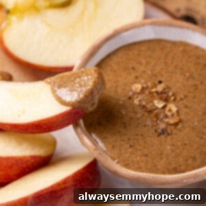 Granola Butter 2 Apple slice dipped in creamy granola butter