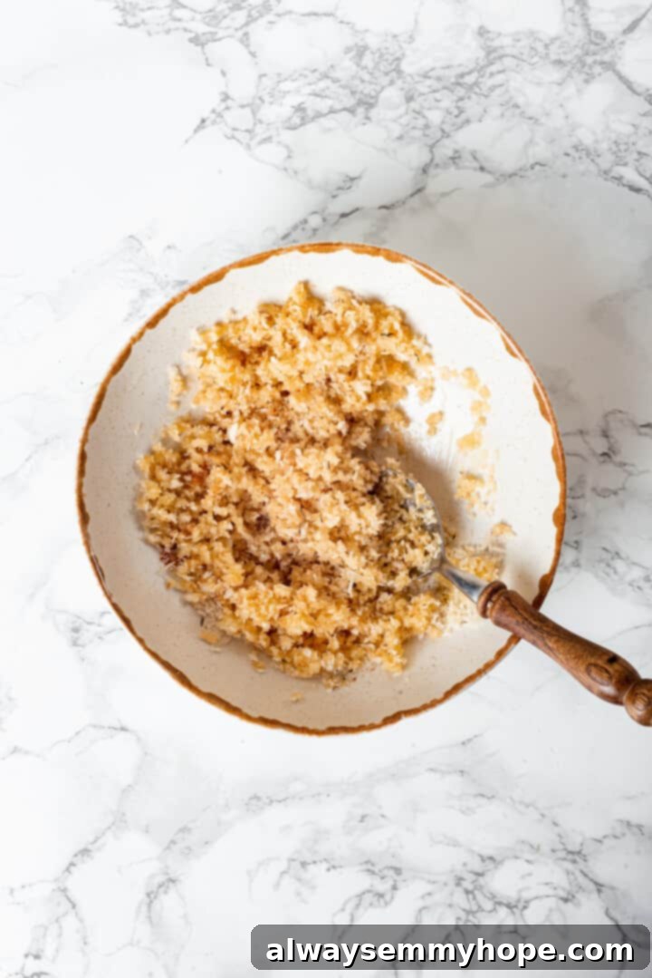 Overhead view of panko topping in small bowl with spoon