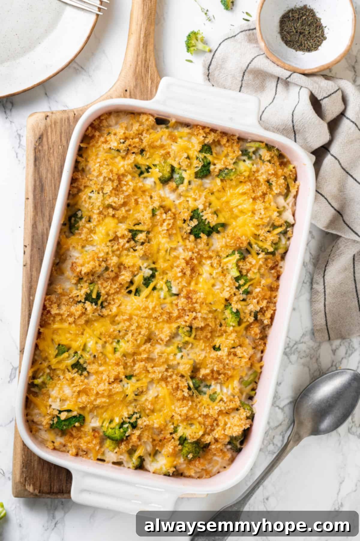 Overhead view of cheesy broccoli rice casserole in baking dish