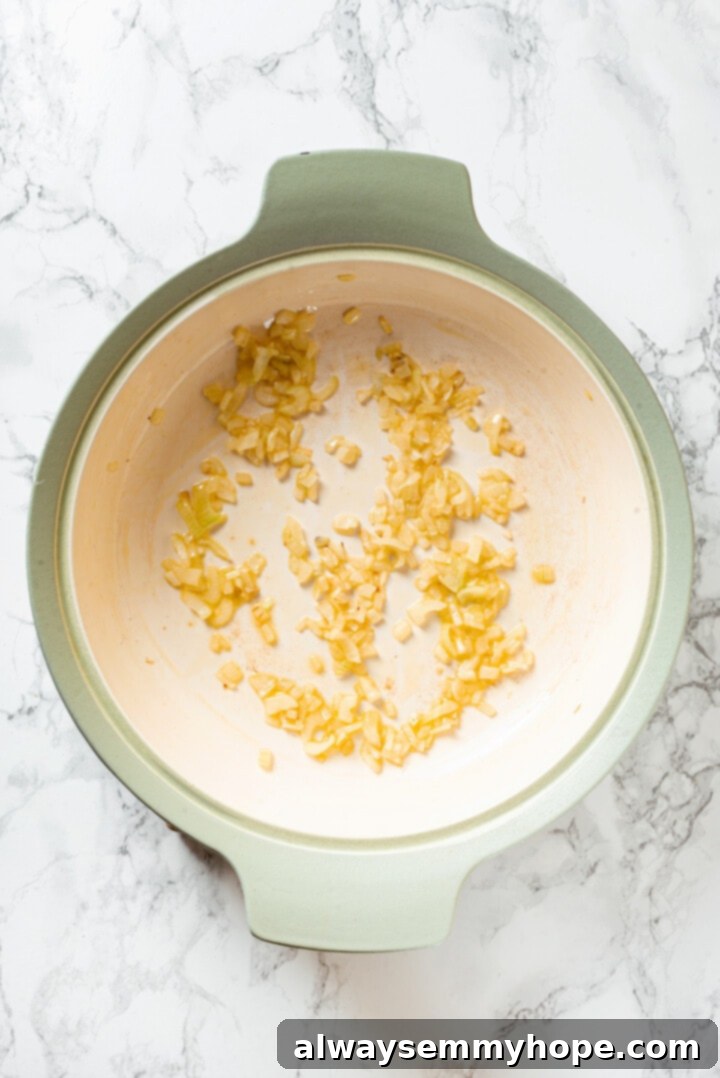 Overhead view of sauteed onions in pot