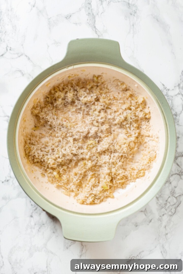 Overhead view of rice added to pot