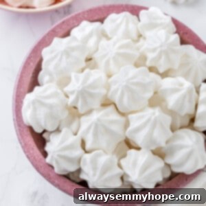 Vegan aquafaba meringues in pink bowl