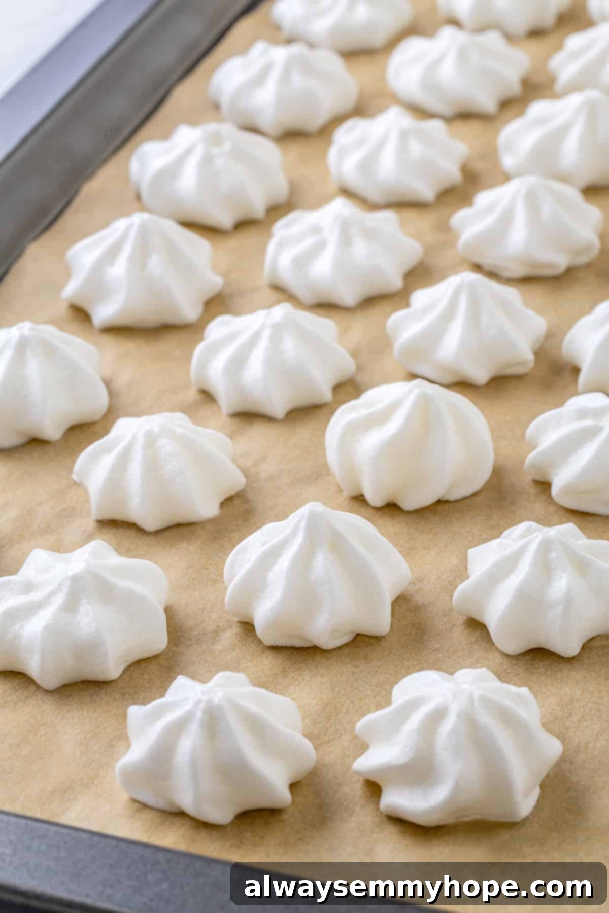 Vegan meringues on parchment lined baking sheet