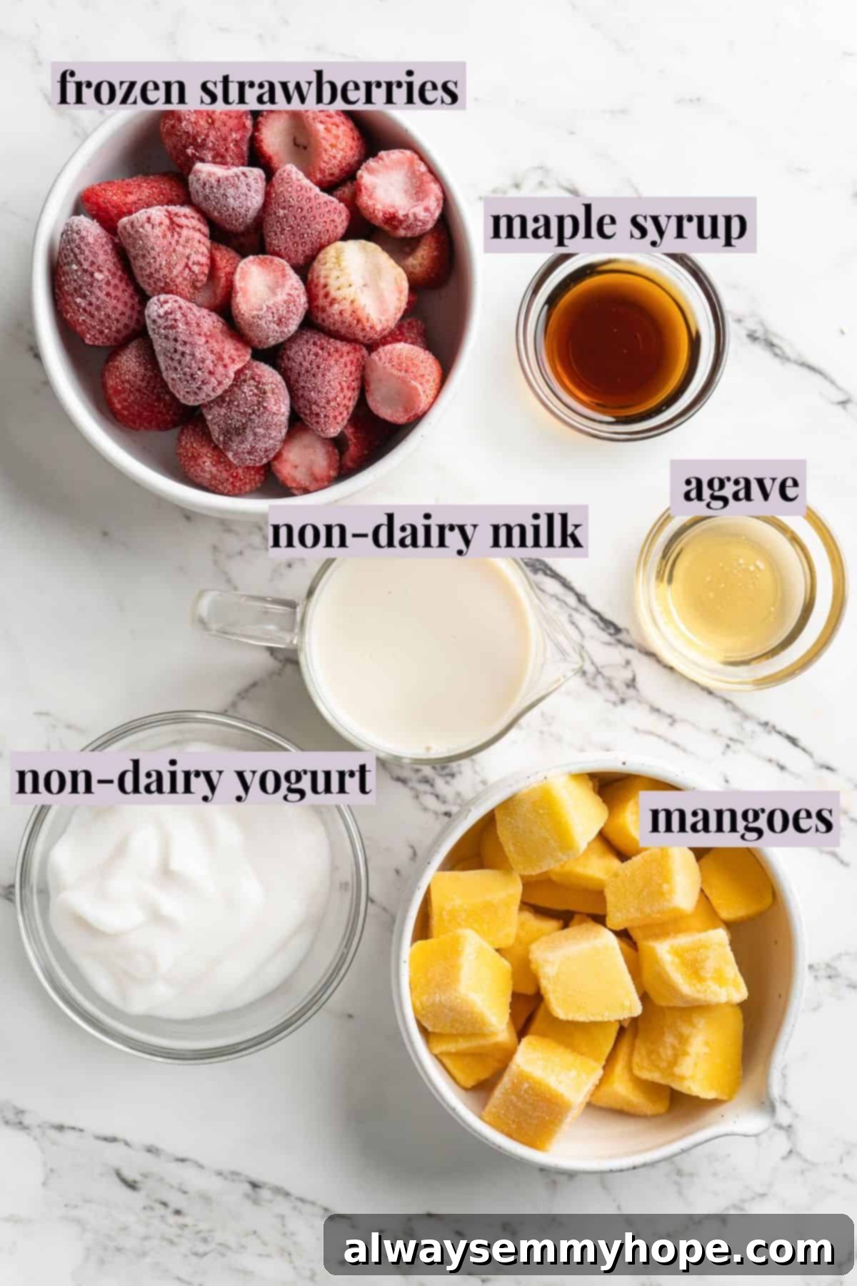 Overhead view of ingredients for strawberry mango smoothie with labels on a countertop