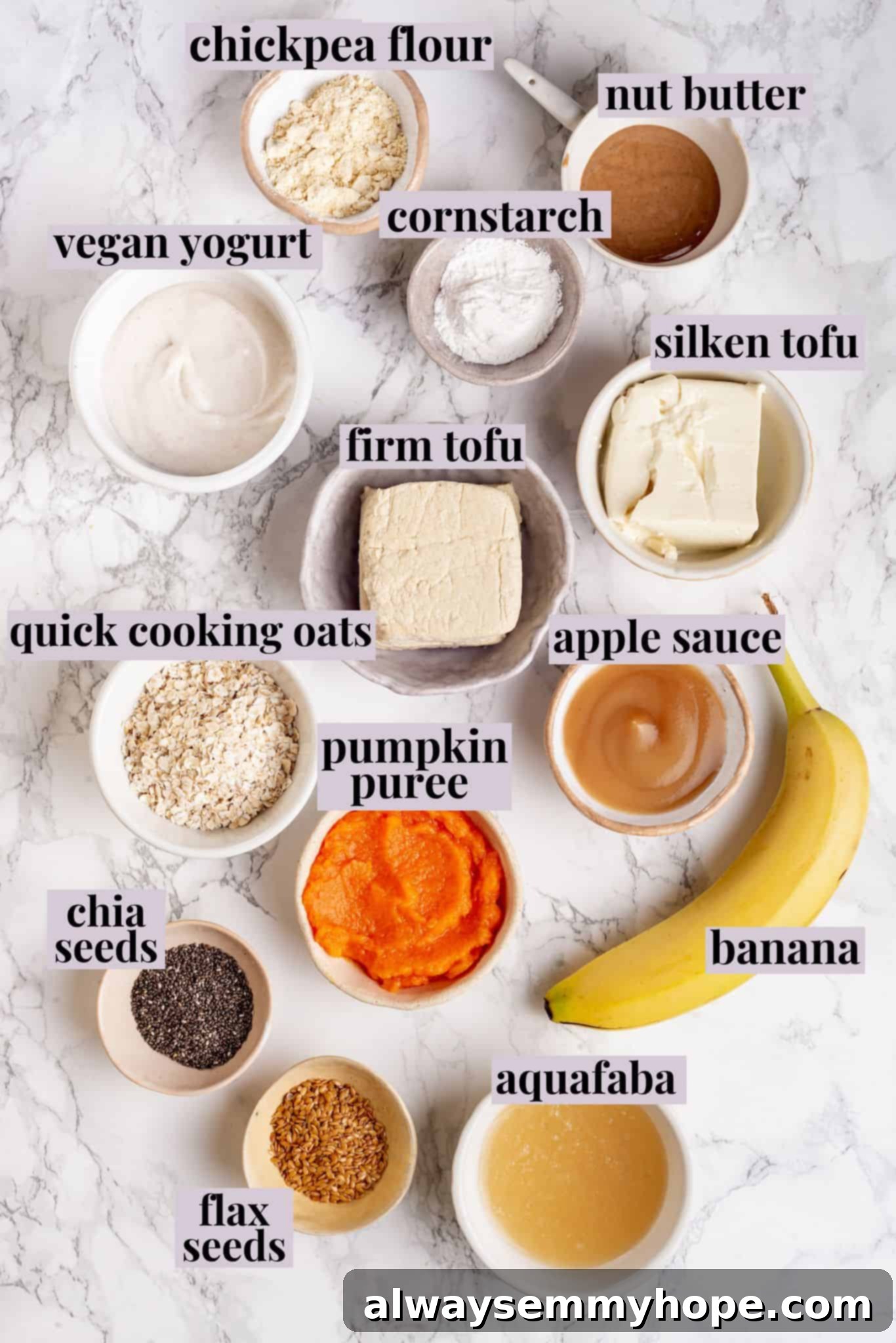 The Essential Vegan Egg Substitutes: Your Complete Guide to Plant-Based Alternatives Overhead view of various vegan egg substitutes arranged on a wooden board, including mashed banana, pumpkin puree, applesauce, flax eggs, and chickpea flour.