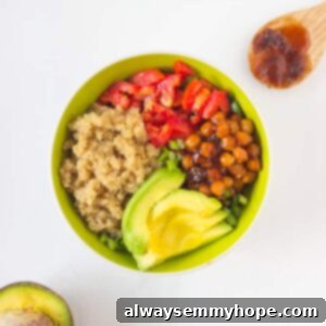 Vibrant Tropical Quinoa Power Bowl with Smoky BBQ Chickpeas 2 Overhead shot of salad bowl in a green bowl, showing all ingredients clearly.
