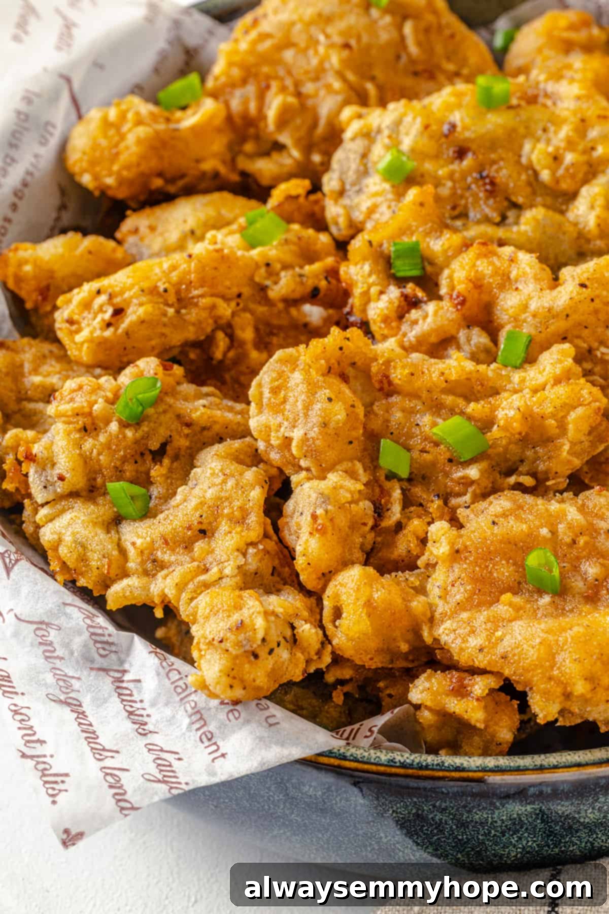 Enjoy this crispy, delicious vegan fried chicken, garnished and ready to devour. Another view of the bowl of vegan fried chicken garnished with sliced green onions, emphasizing its appealing presentation.