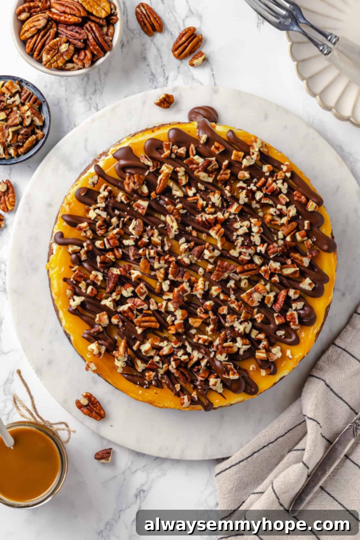 Overhead view of turtle cheesecake on marble platter