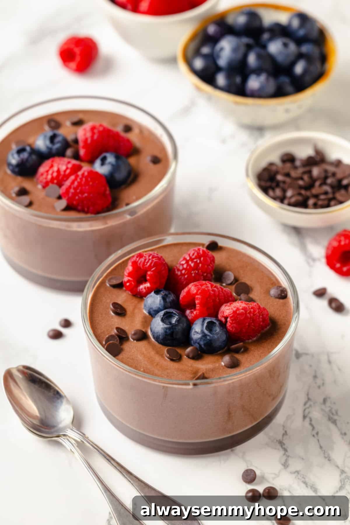 Two bowls of creamy chocolate protein pudding