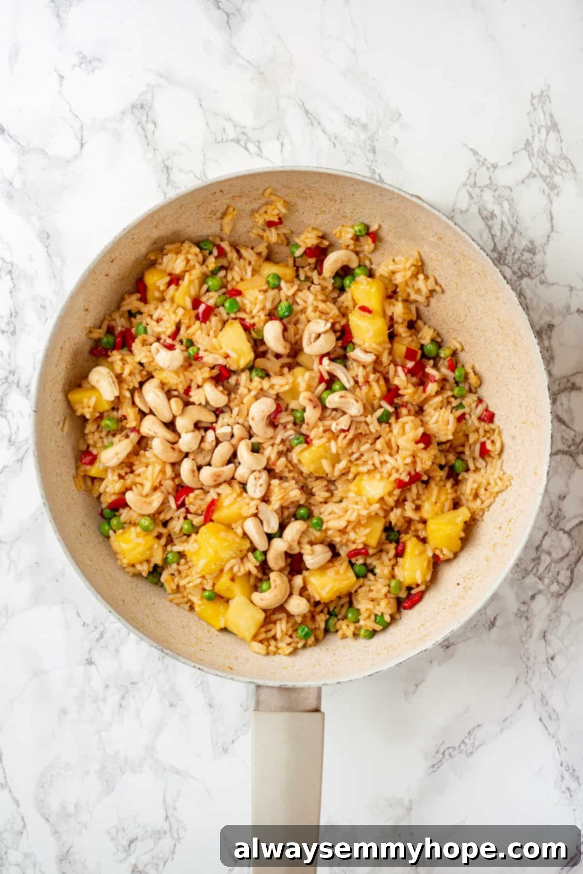Overhead view of pineapple fried rice in pan