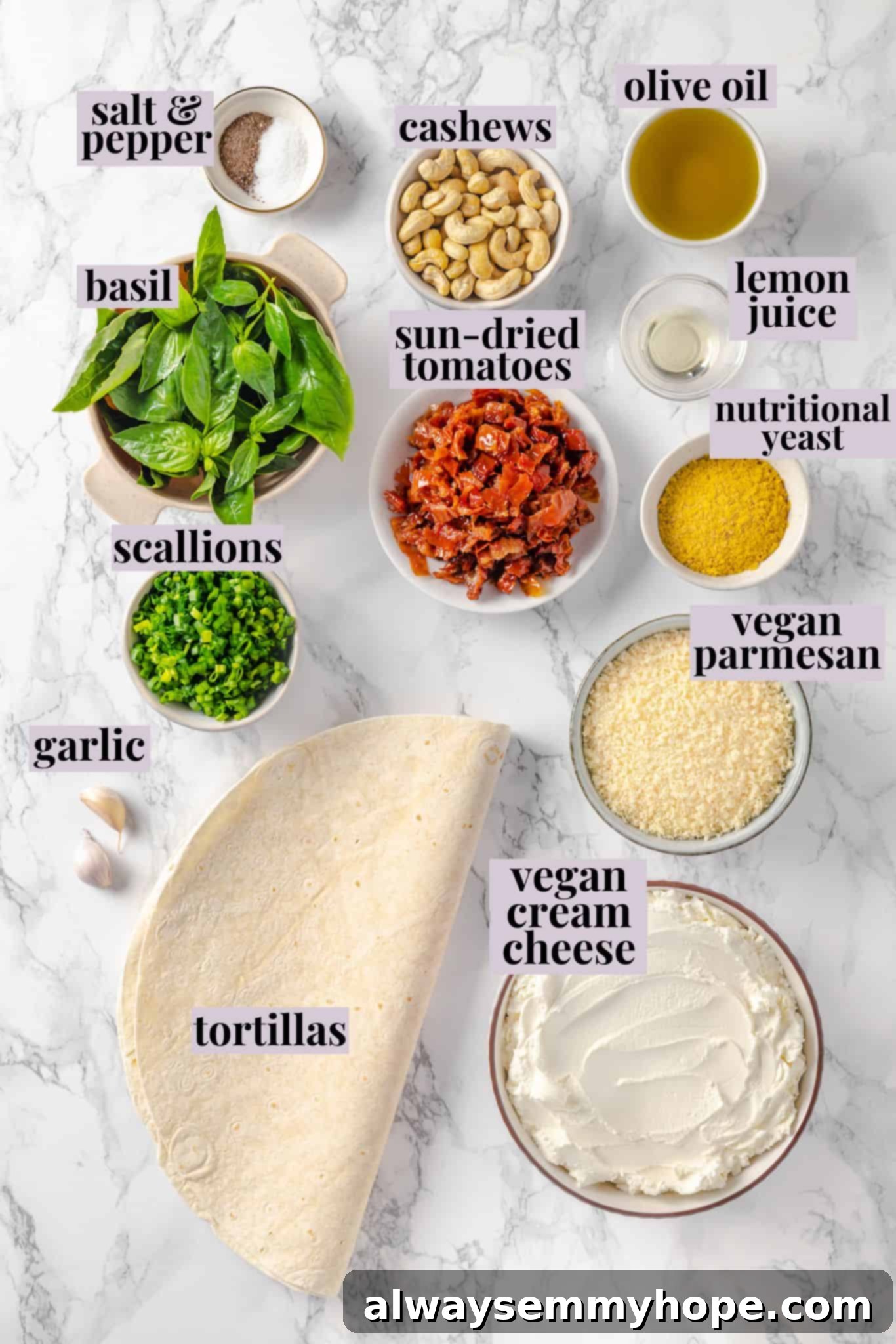 With cream cheese, pesto, Parmesan, and sun-dried tomatoes, these easy pinwheel sandwiches are full of flavour. Great for a party or lunch! Overhead view of pinwheel sandwich ingredients with labels