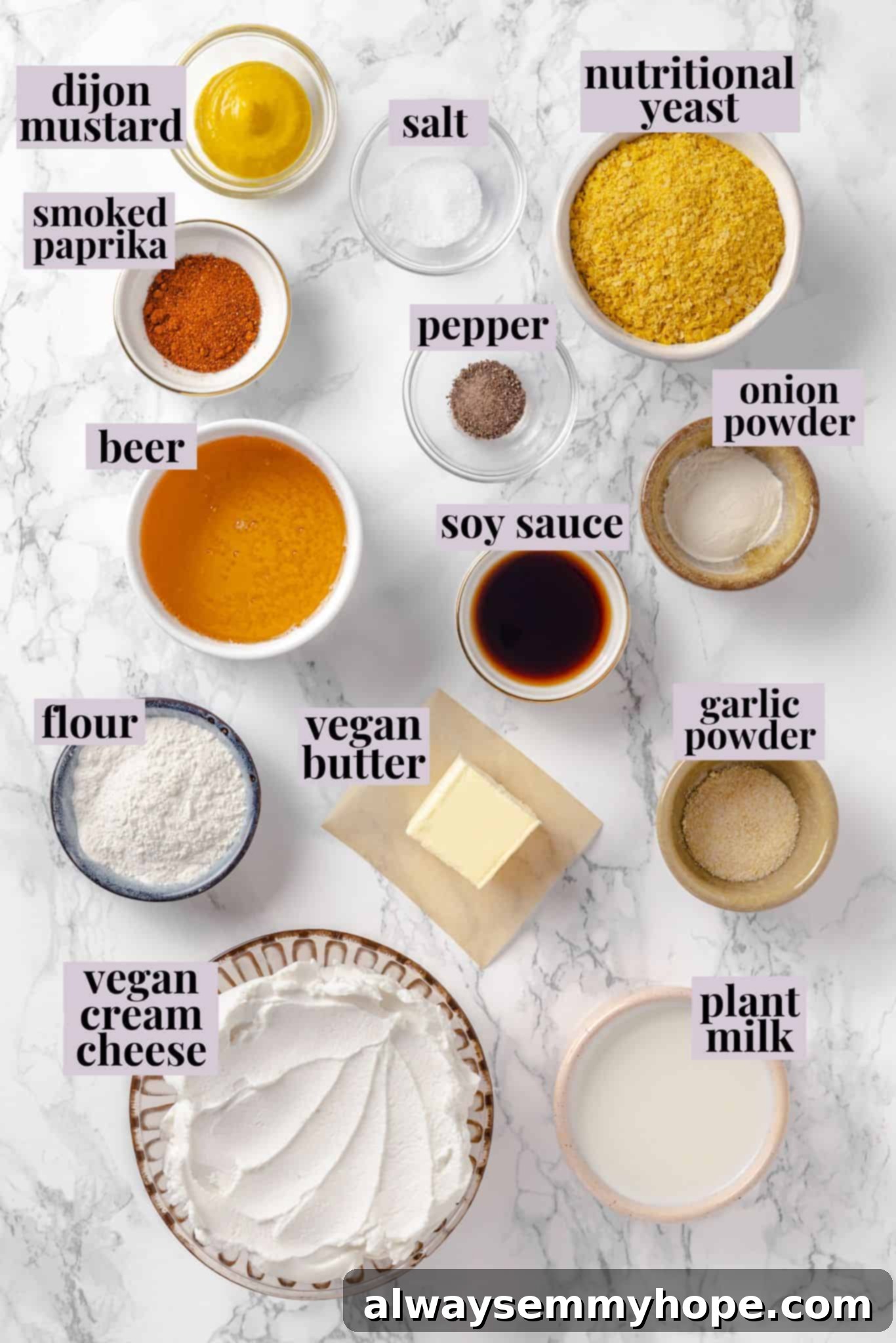 Overhead view of all ingredients for vegan beer cheese pretzel dip laid out with labels
