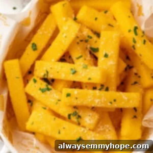 Crispy Polenta Bites 2 Overhead view of crispy fried polenta topped with parmesan and parsley