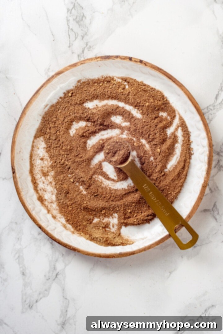 Spice mixture on plate with measuring spoon, ready for blending